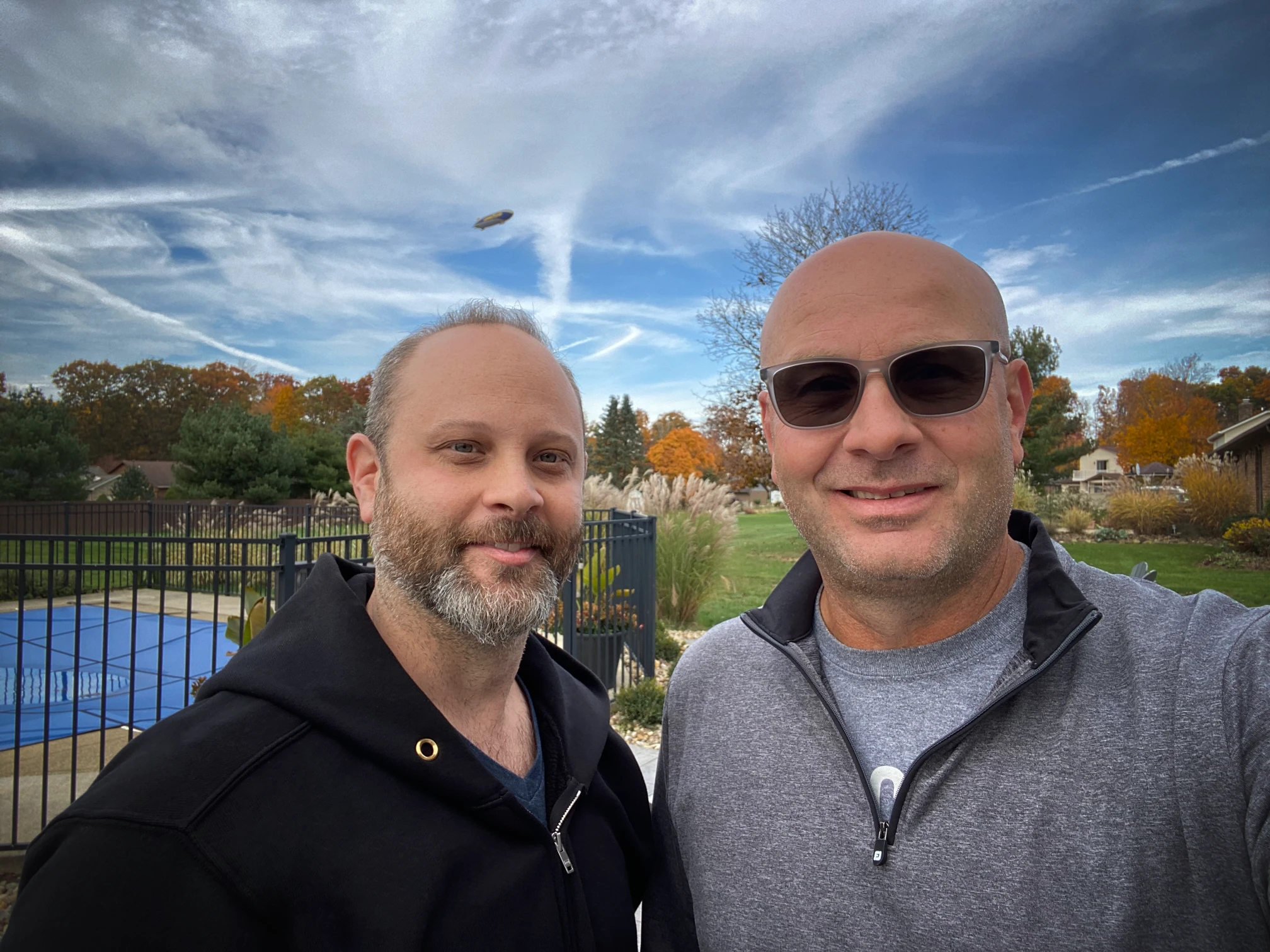 Photo of Cimply Founders in Akron Ohio outside with the iconic Goodyear blimp circling above